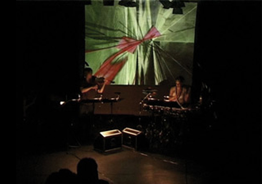 Claudia Hansen percussion and Maria Moros Ballesteros viola performing Agaya Shi with live visuals by David Benque