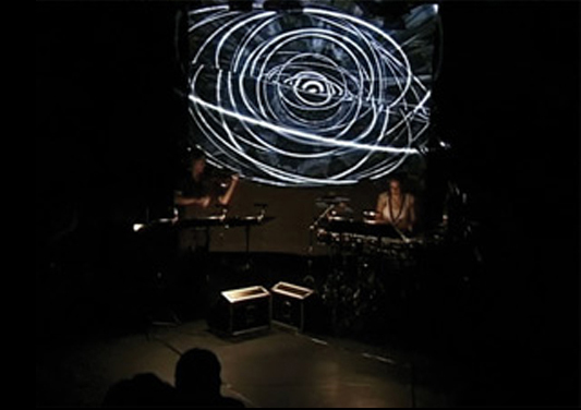 Claudia Hansen and Maria Moros Ballesteros performing The Third Half of the Last Part 1 with live visuals by David Benque