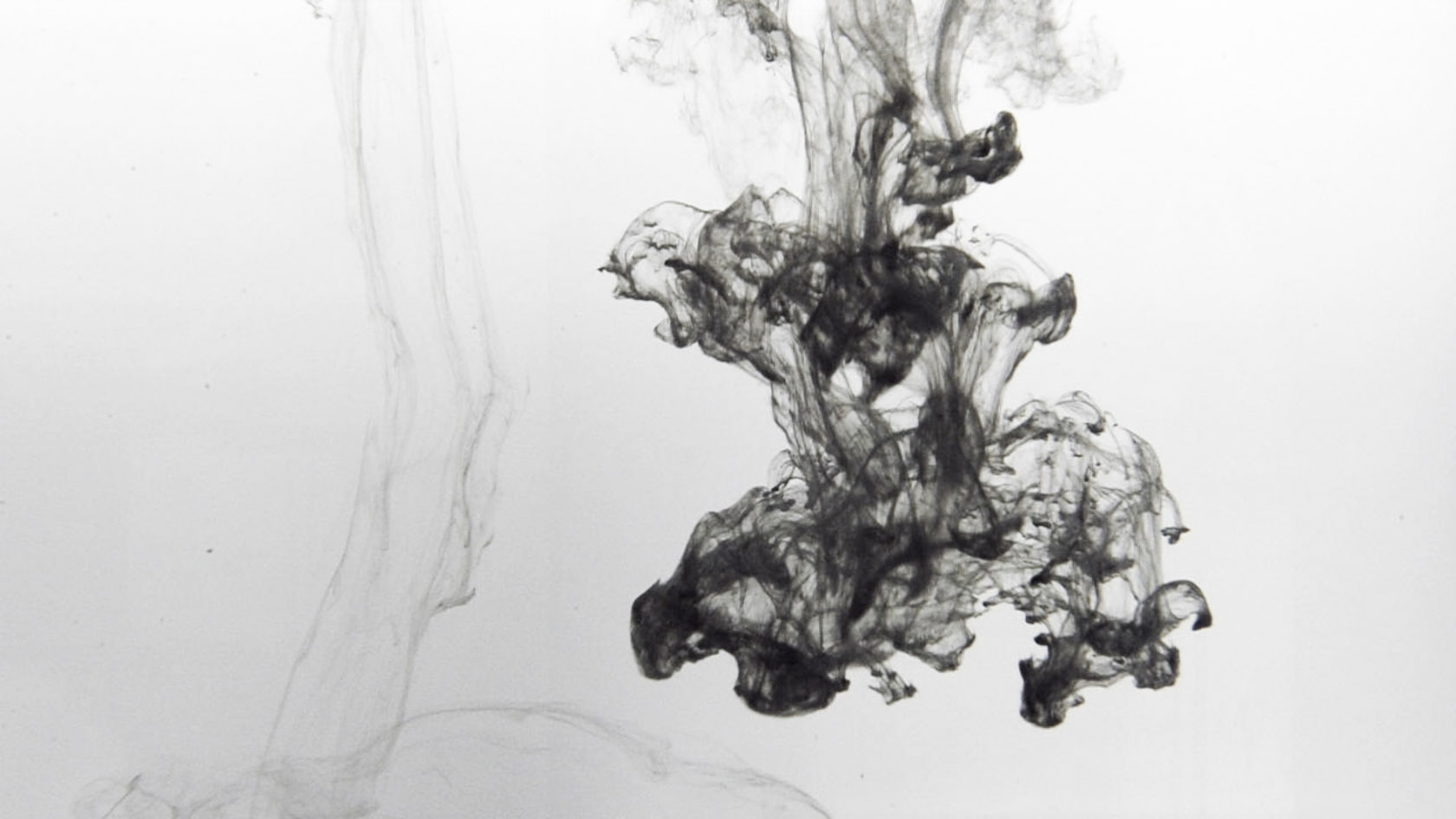 ink dissolving in water from video live visuals by Claudia Hansen in black and white